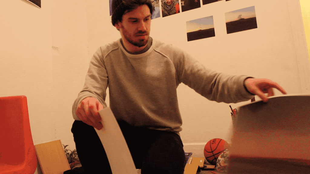 A hotbe team member choosing what to exhibit in the gallery