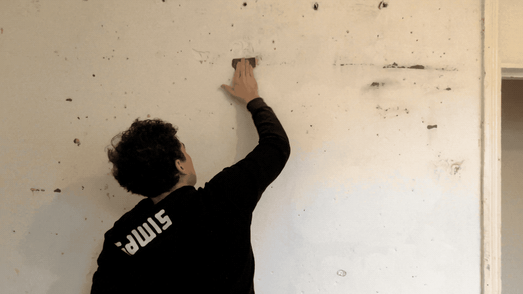 Scrubbing down a basement wall